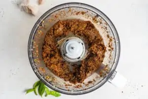 overhead of sun dried tomato pesto in food processor bowl