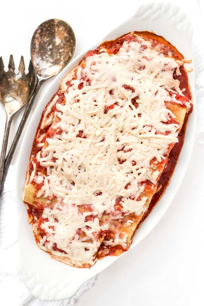 This PERFECT Vegan Manicotti is made with a creamy tofu ricotta and topped with a homemade tomato sauce!