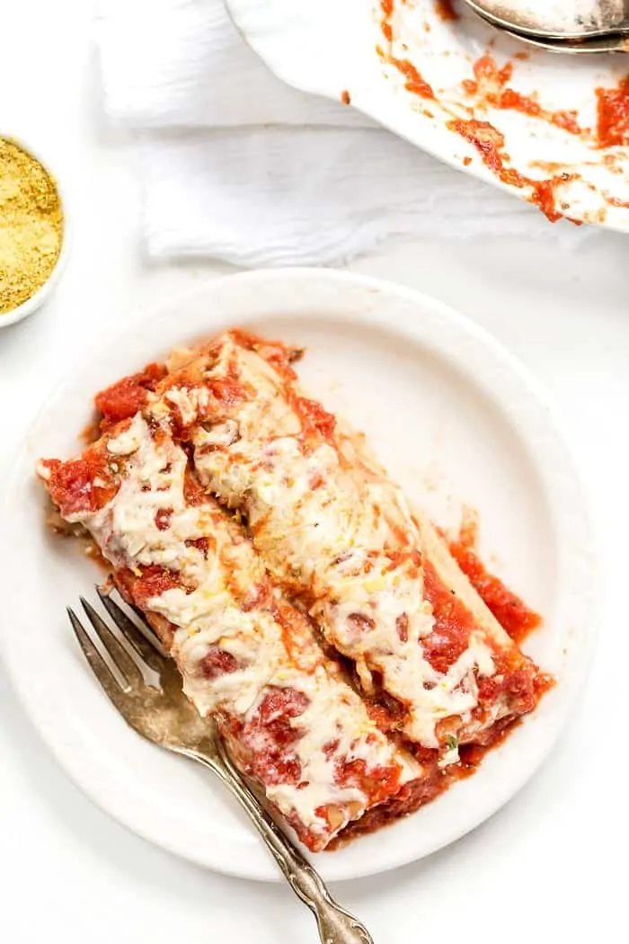 This PERFECT Vegan Manicotti is made with a creamy tofu ricotta and topped with a homemade tomato sauce!