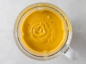 creamy acorn squash soup in a blender