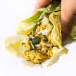 smashed curry chickpea salad served in a lettuce wrap