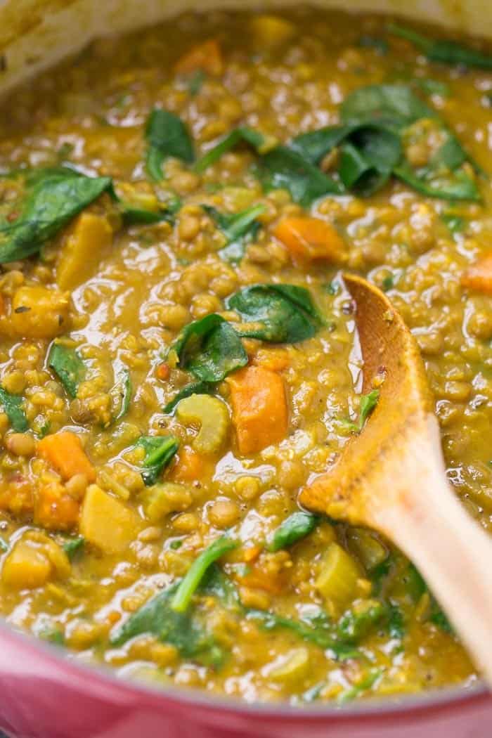 detox turmeric lentil soup cooking in a dutch oven