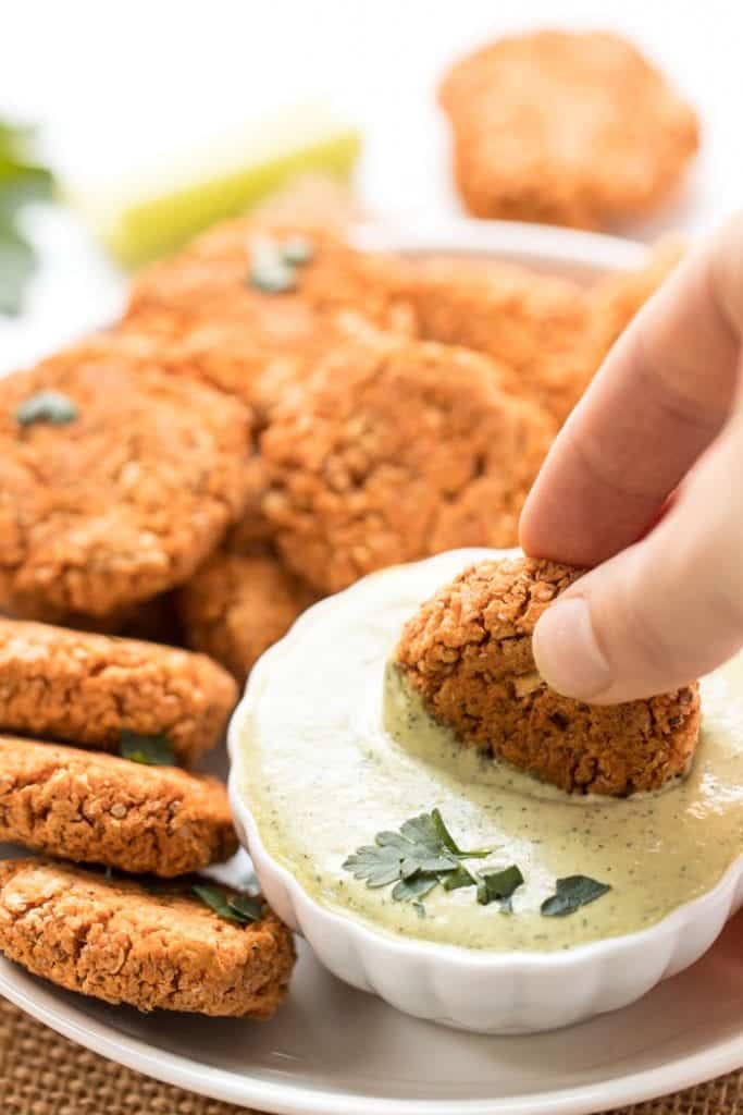 vegan buffalo quinoa bites dipped in vegan ranch dressing