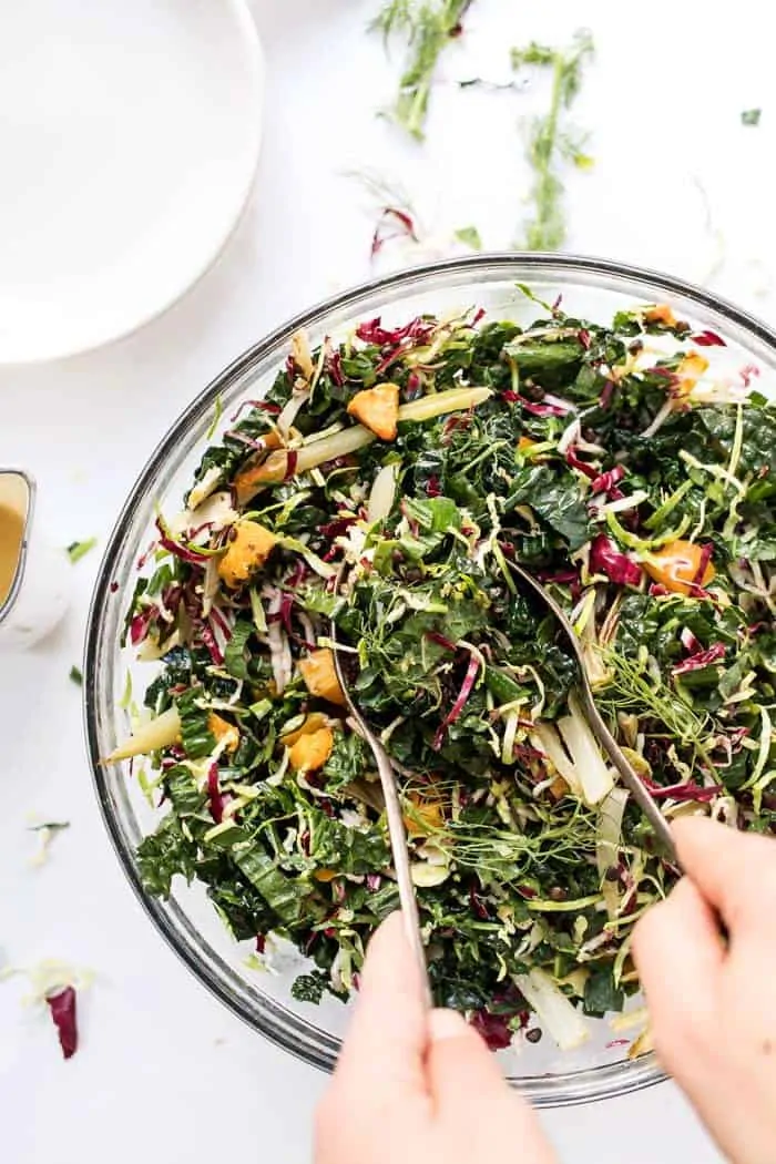 serving a winter kale salad with lentils