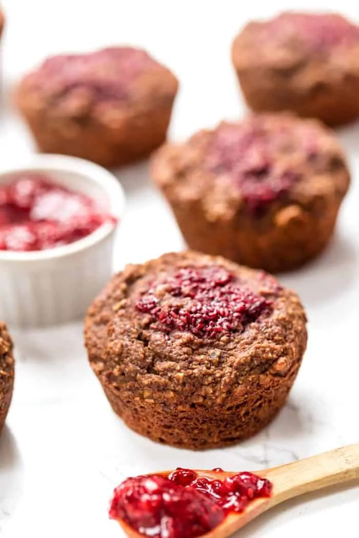 healthy chocolate muffins topped with raspberry chia seed jam