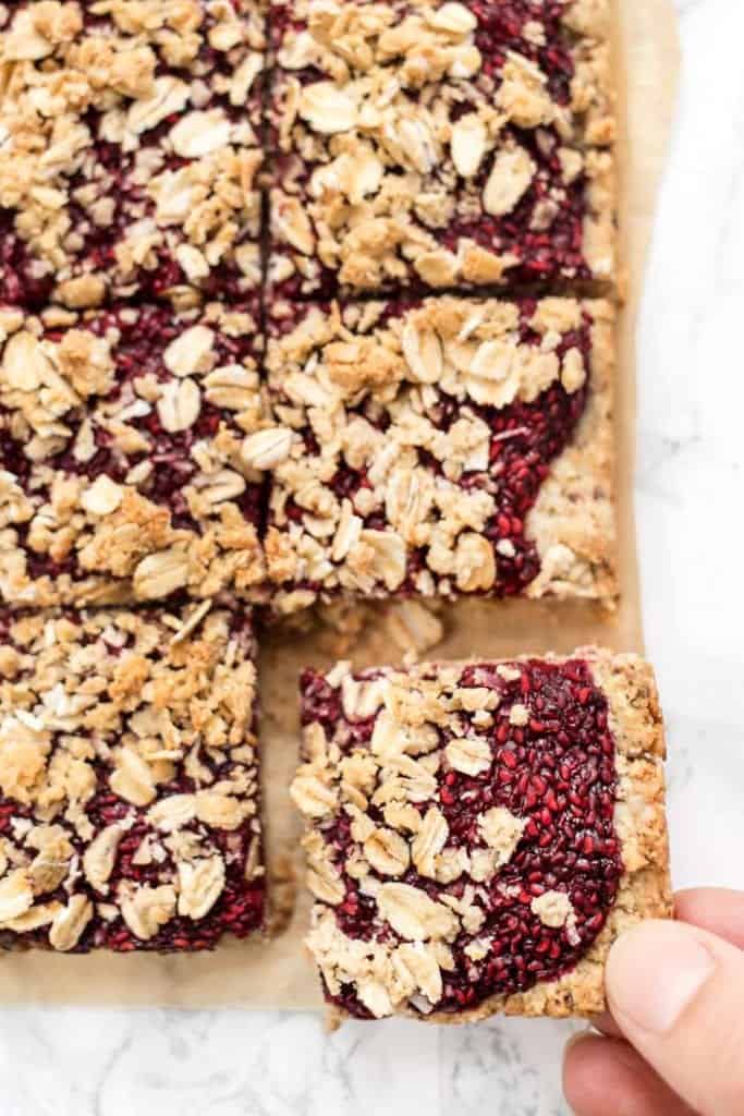 simple vegan raspberry oatmeal bars with an oat-almond flour topping