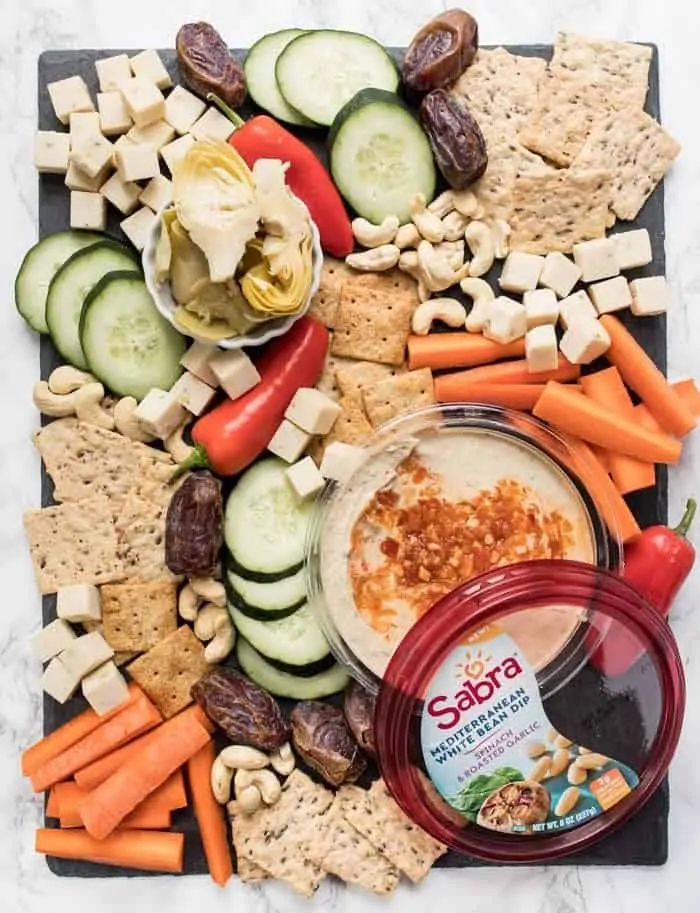 healthy vegan snack board with white bean dip