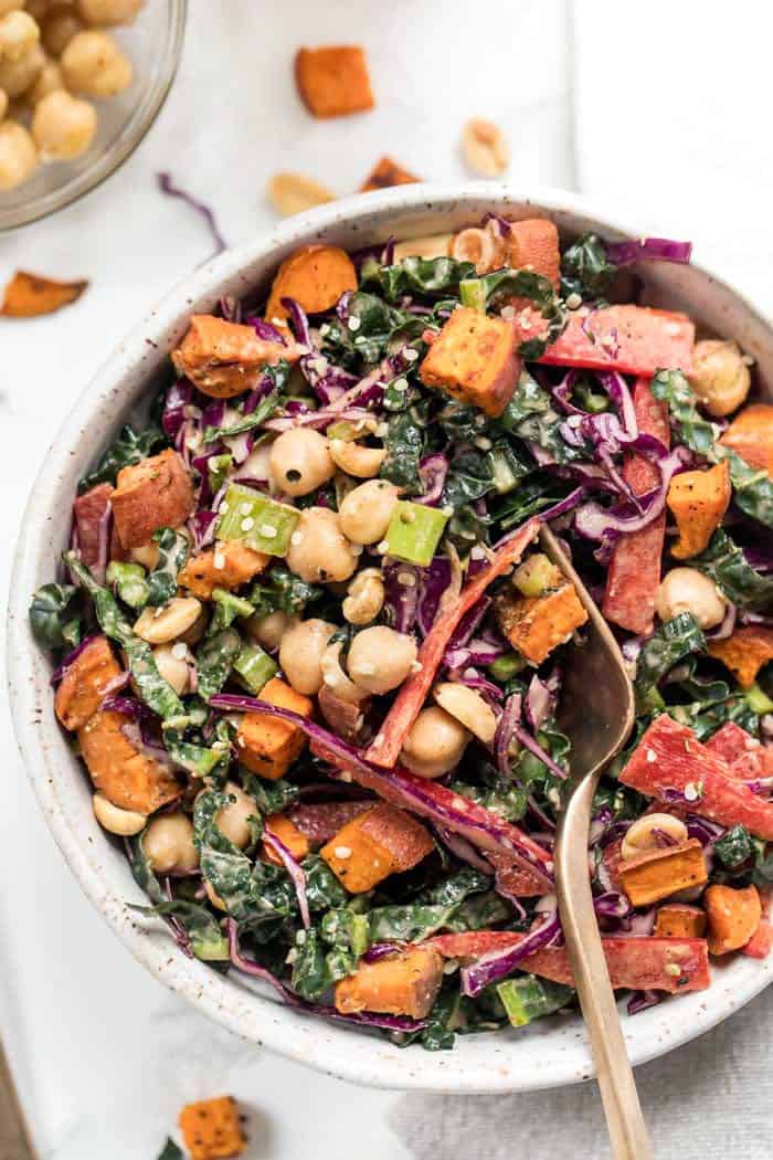 easy superfood kale salad with thai almond butter dressing