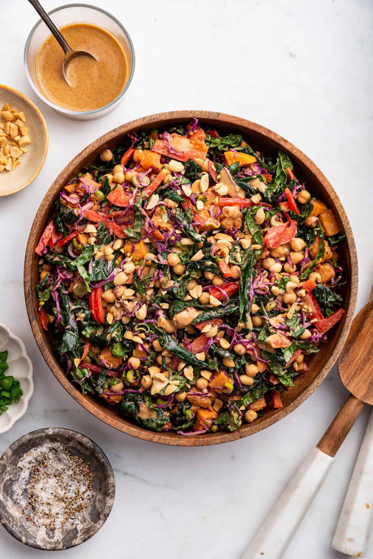 Overhead view of kale sweet potato salad in large wood bowl