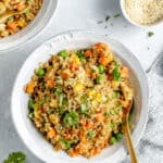 white bowl with quinoa fried rice and vegetables