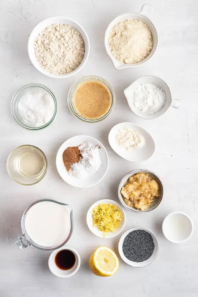 Flour, milk, banana and other ingredients on marble countertop