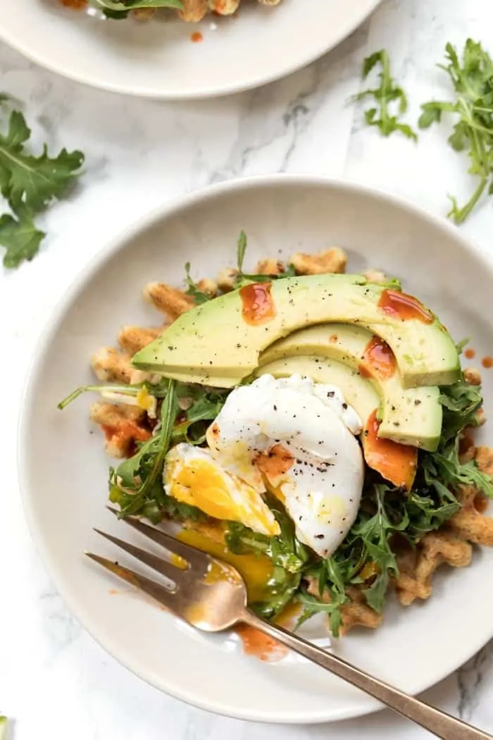 zucchini almond flour waffles with hummus and arugula