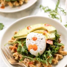 savory zucchini breakfast waffles with hummus and poached eggs