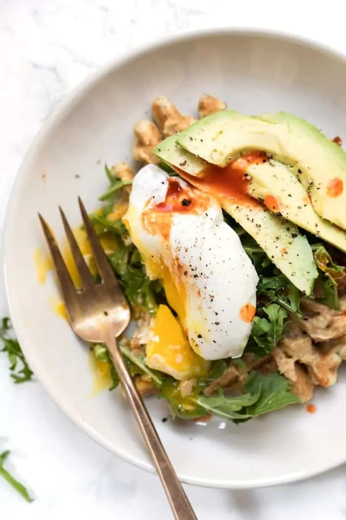 zucchini almond flour waffles with hummus and arugula