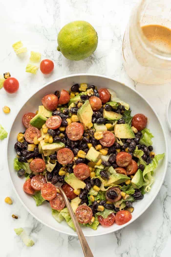 healthy vegetarian taco salads with black beans, romaine and avocado