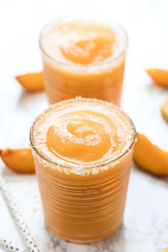 This easy 3-Ingredient Mango Peach Frosé recipe is the ultimate summer cocktail! It's naturally sweet, refreshing, and perfect for a hot day! Two glasses of mango peach frose
