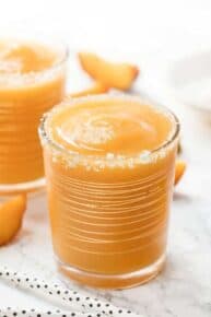 Glass of mango peach frose slushie