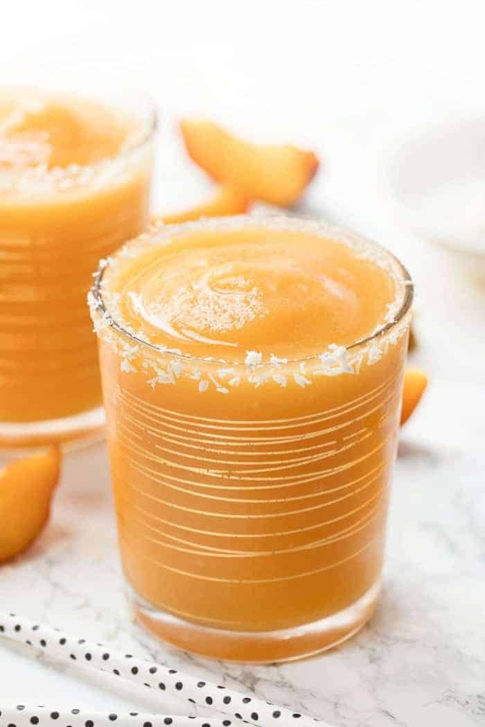 Glass of mango peach frose slushie