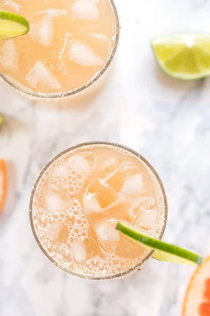 These Healthy Grapefruit Margaritas use just 4 ingredients and have no added sugar! They're a refreshing twist on the skinny margarita! Overhead view of grapefruit margaritas in glasses