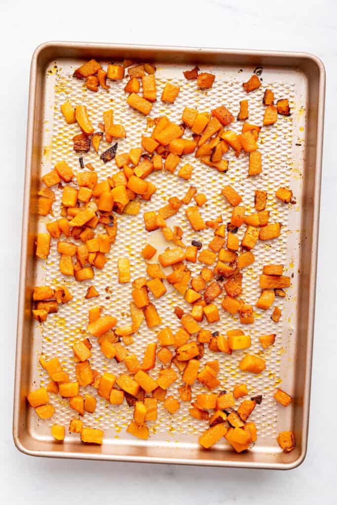 Overhead view of roasted butternut squash on pan