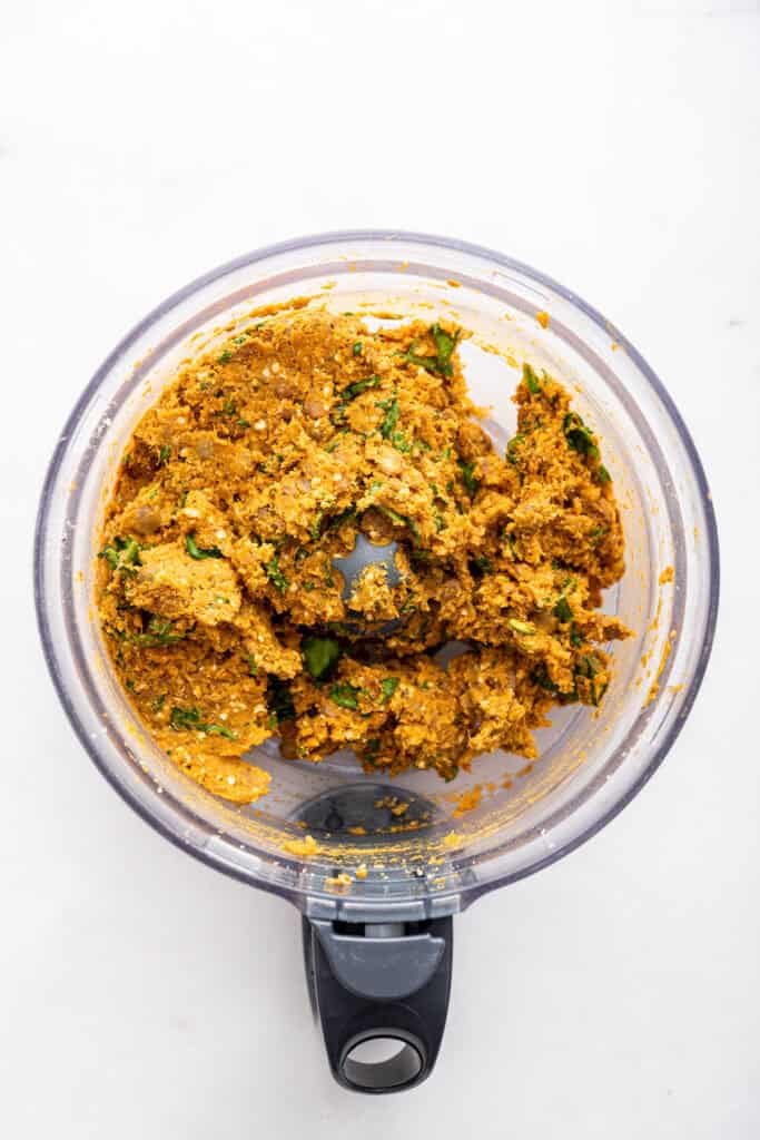 Overhead view of lentil patty mixture in food processor