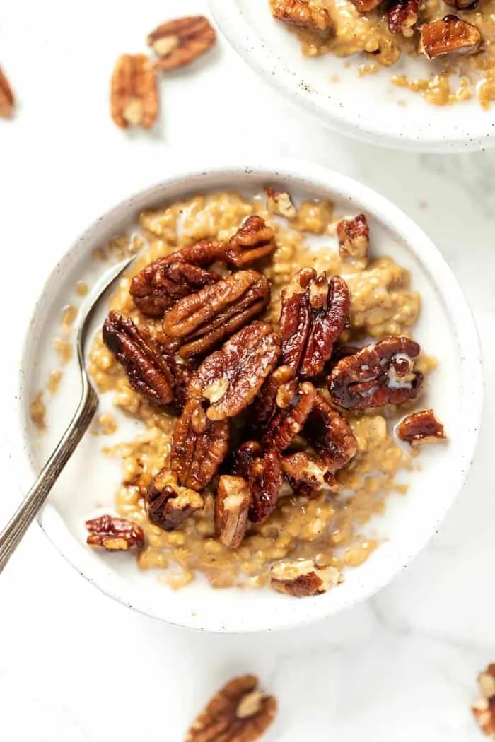 This vegan pumpkin steel cut oatmeal recipe can be made in 30 minutes, and is bursting with flavor from caramelized pecans Creamy Pumpkin Steel Cut Oats