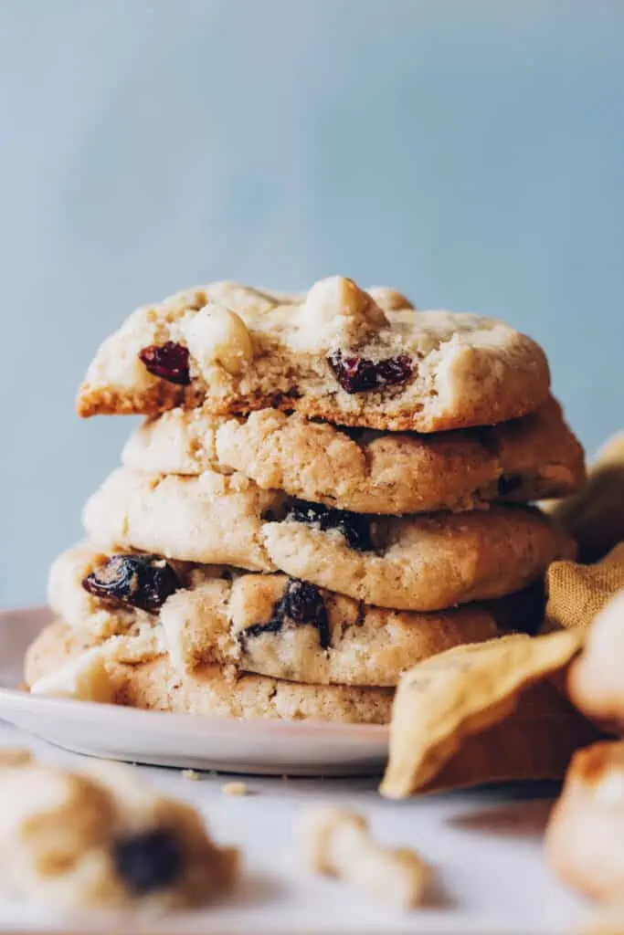 stack of cranberry macadamia nut cookies that are gluten-free and vegan