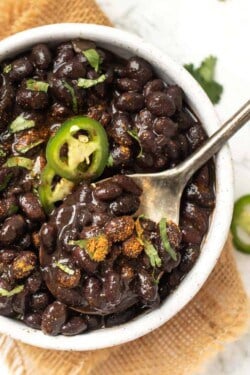 Spoonful of Instant Pot black beans set in bowl