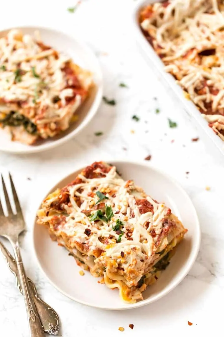 A slice of butternut squash lasagna on a white plate