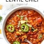 Overhead view of lentil chili in bowl with spoon