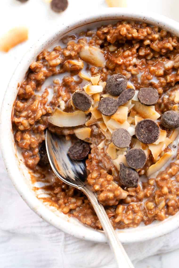 Learn how to make the creamiest steel-cut oats in the Instant Pot. This easy method works every time. Plus, get 6 flavor variations! Chocolate Coconut Steel Cut Oats