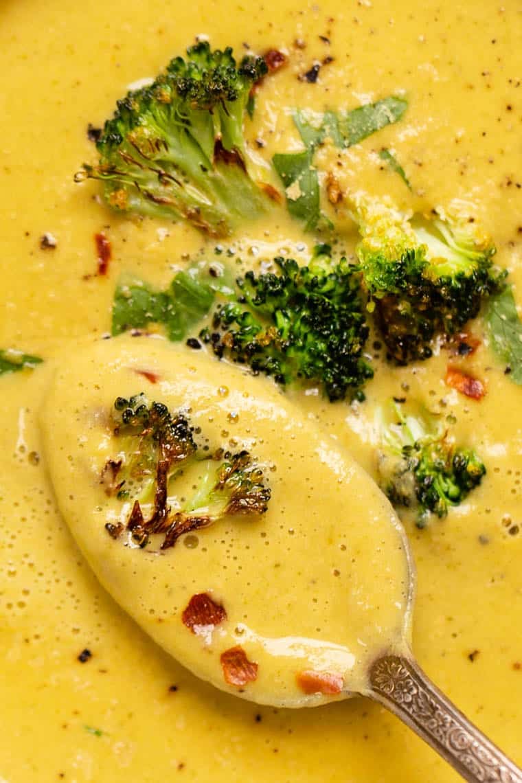 Closeup of spoonful of creamy vegan broccoli soup
