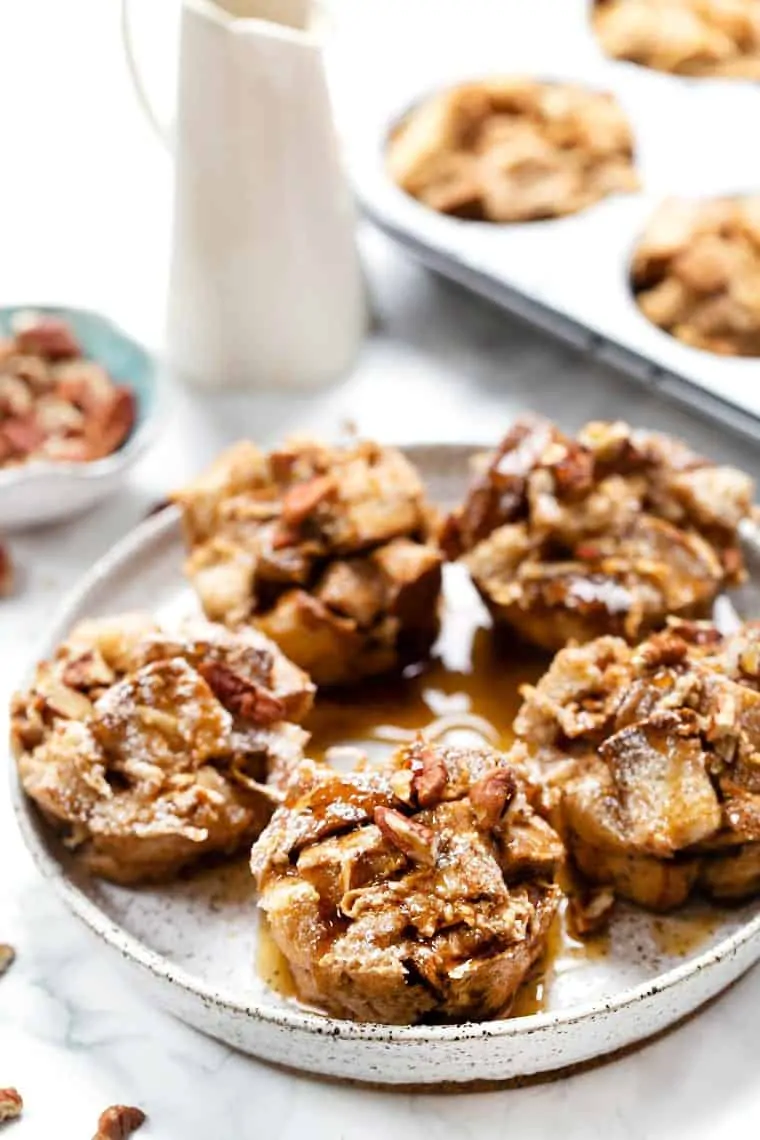 This easy French toast muffins recipe is flavored with cinnamon and apple for warm, cozy vibes. A meal prep breakfast you'll feel good about! Vegan French Toast Muffins with Apples on plate