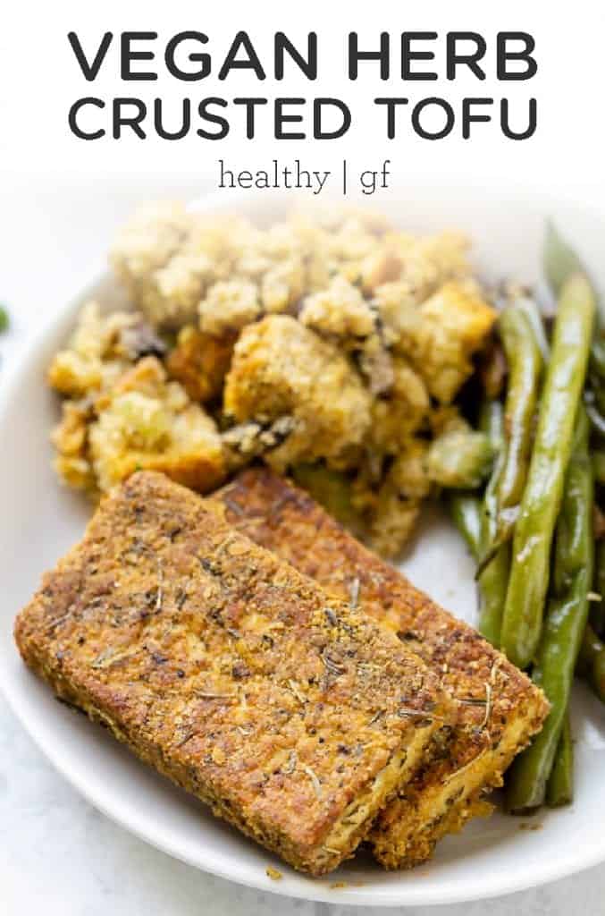 This Vegan Herb Crusted Tofu makes a delicious vegetarian entree or side dish for a crowd at Thanksgiving! This easy homemade recipe is made with quinoa flour, nutritional yeast, garlic and healthy seasonings and spices!