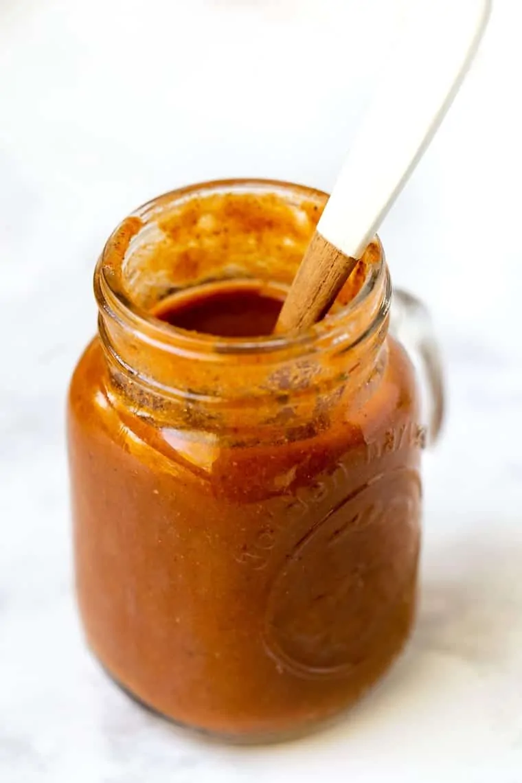 A jar of homemade enchilada sauce