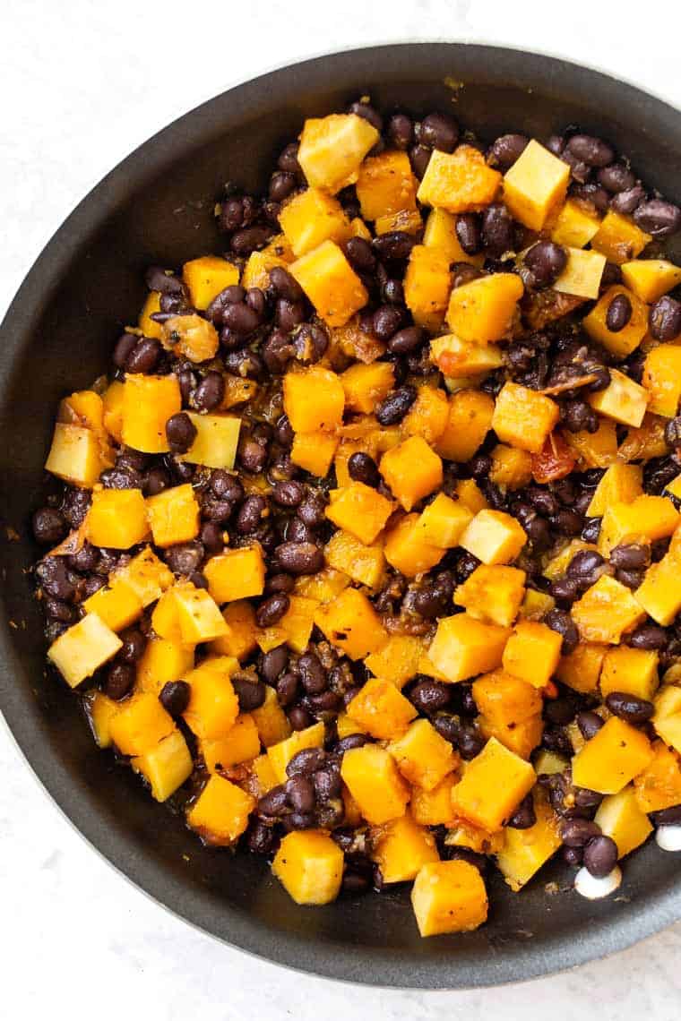 These amazing vegan black bean enchiladas also have butternut squash and a homemade enchilada sauce. They're easy, flavorful, and gluten-free! Butternut Squash Black Bean Enchilada Filing