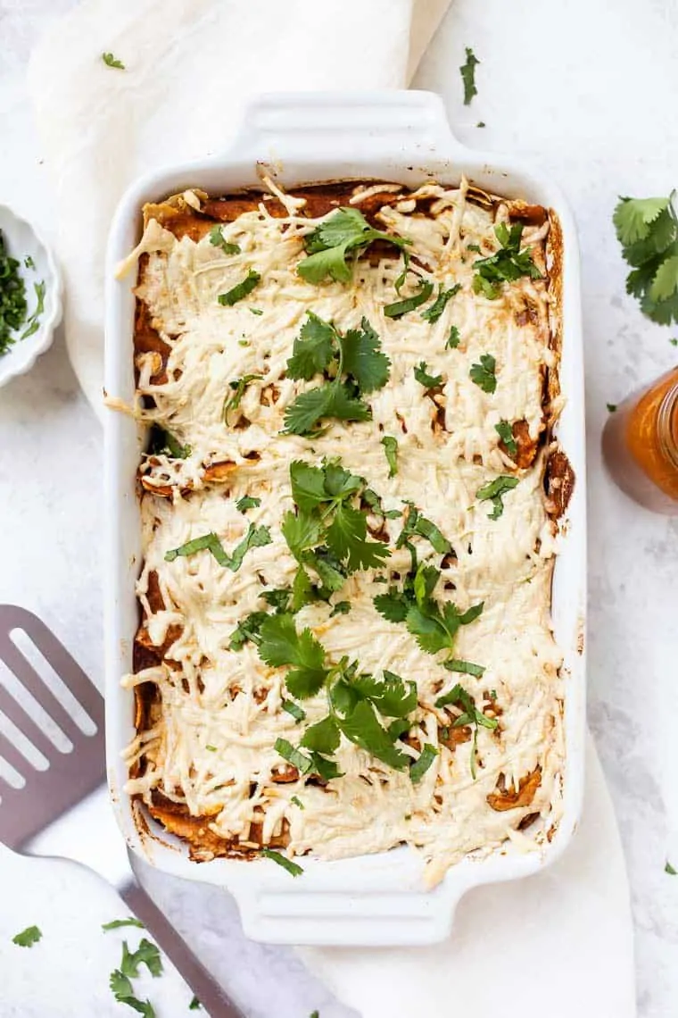 These amazing vegan black bean enchiladas also have butternut squash and a homemade enchilada sauce. They're easy, flavorful, and gluten-free! Vegan Black Bean Enchiladas in a casserole dish