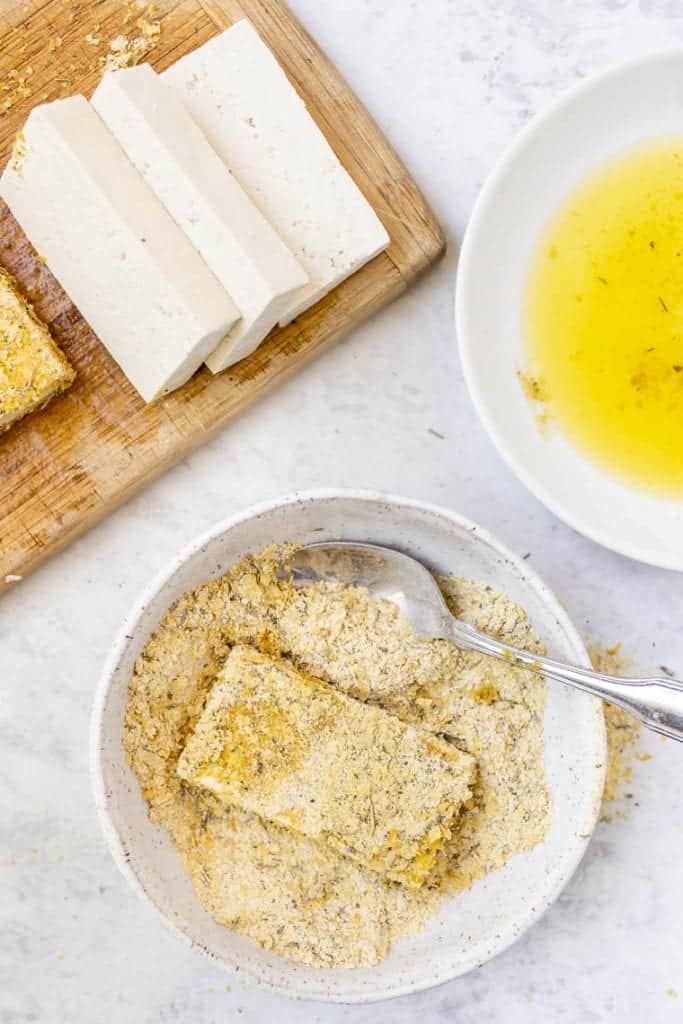 overhead of tofu crusted in nutritional yeast