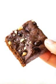 Hand holding espresso brownie square