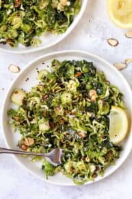 Top down view of shaved Brussels sprout salad on plate