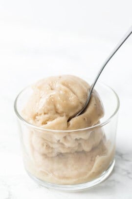 Vanilla banana ice cream in glass bowl with spoon
