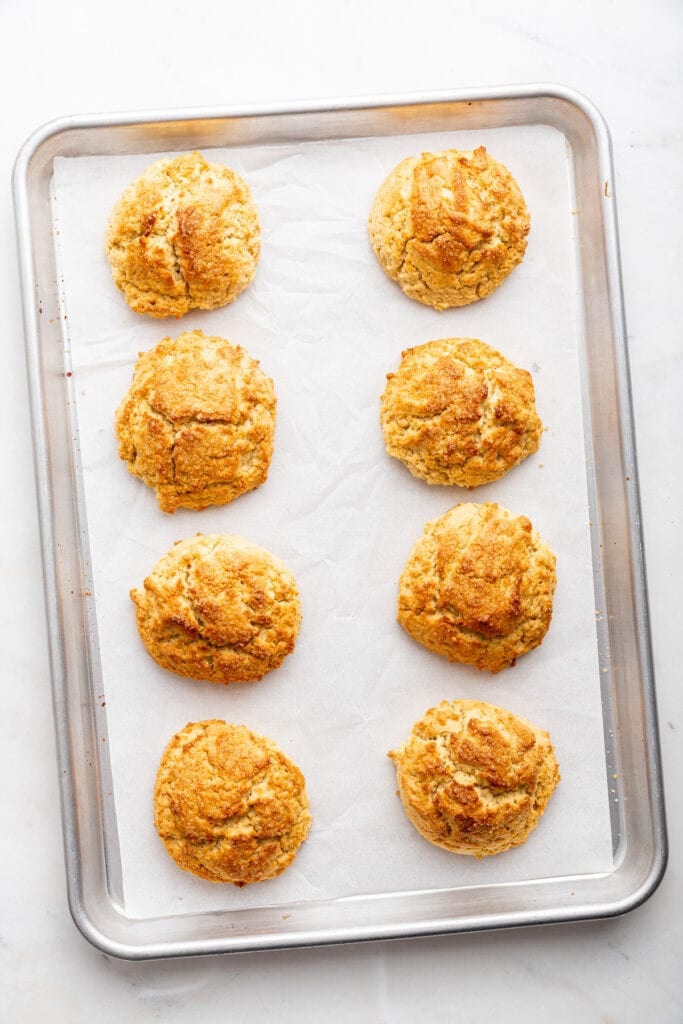Overhead view of biscuits baked on sheet pan