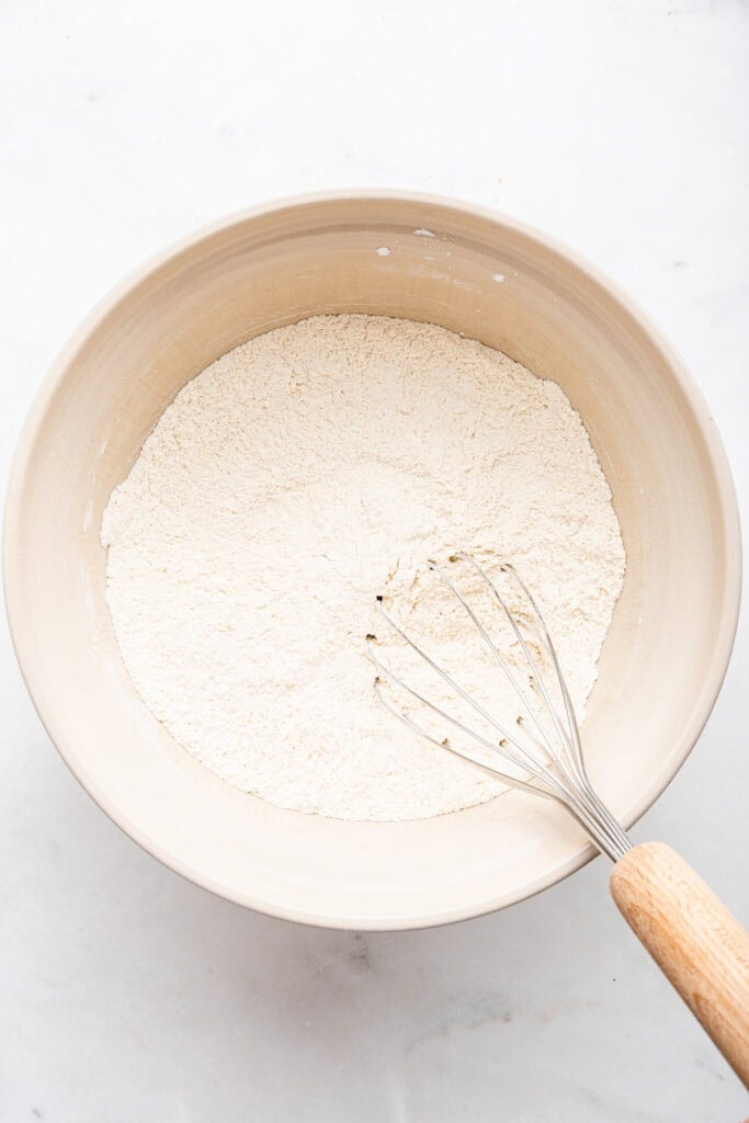 Whisking dry ingredients in mixing bowl