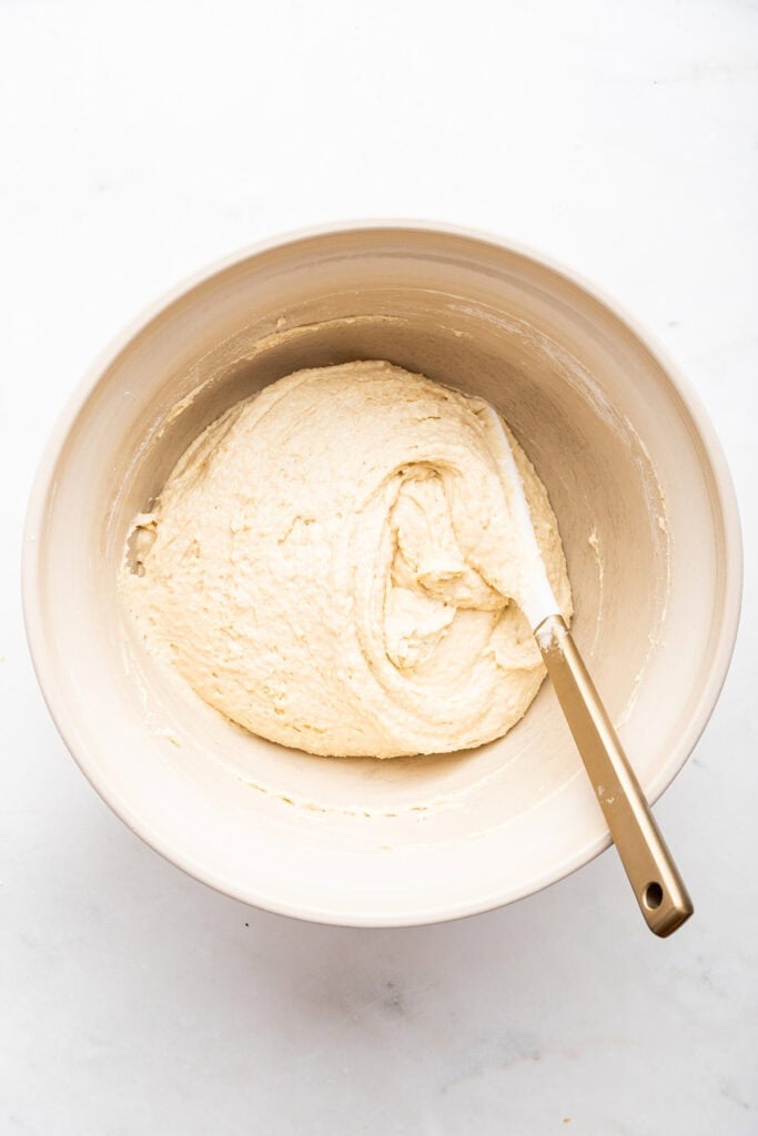 Overhead view of biscuit dough in mixing bowl
