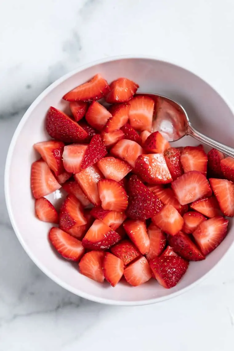 Bowl of strawberries with spoon