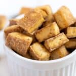 Bowl full of crispy tofu cubes