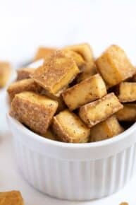 Bowl full of crispy tofu cubes