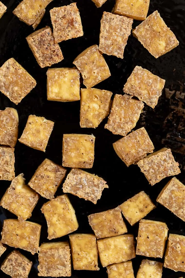 Overhead view of crispy baked tofu on pan