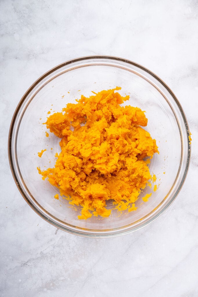 Overhead view of mashed sweet potatoes in bowl