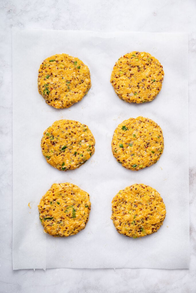 Uncooked salmon patties on parchment paper